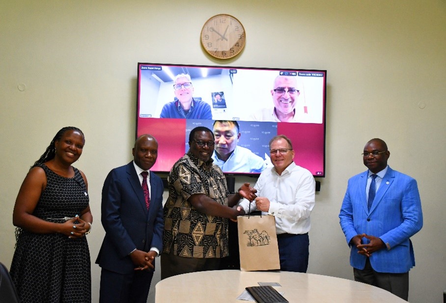 AIRCA members represented with Dr Dennis Rangi receiving a gift from the President and CEO of the IFDC