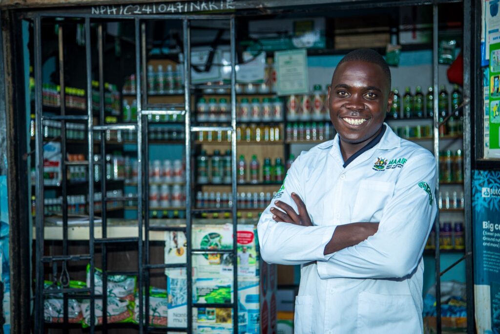 Agro-dealer stands proudly in front of his shop