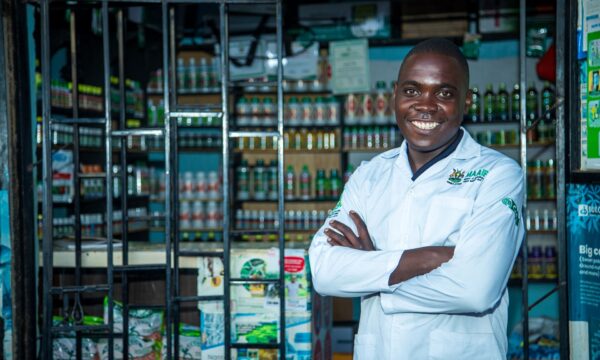 Agro-dealer stands proudly in front of his shop